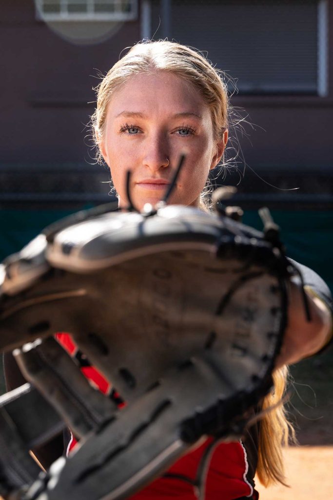 powered by georgia milk softball player with mitt close to camera