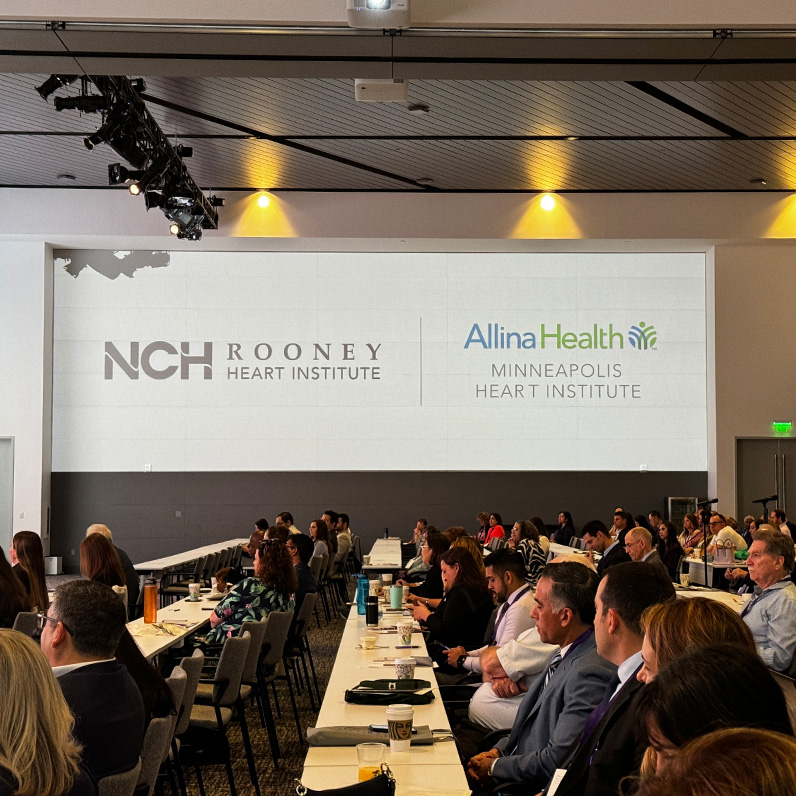nch cardio summit image of attendees with logos on a large screen