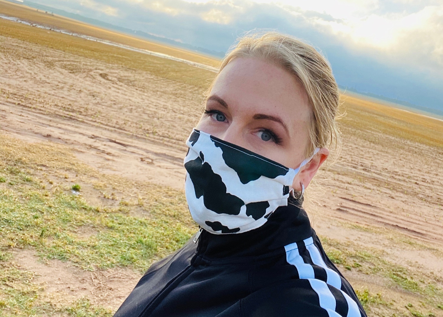 a woman wearing a cow face mask amanda lucey