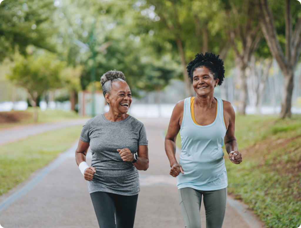 HSS at NCH two older women running on a tree lined trail