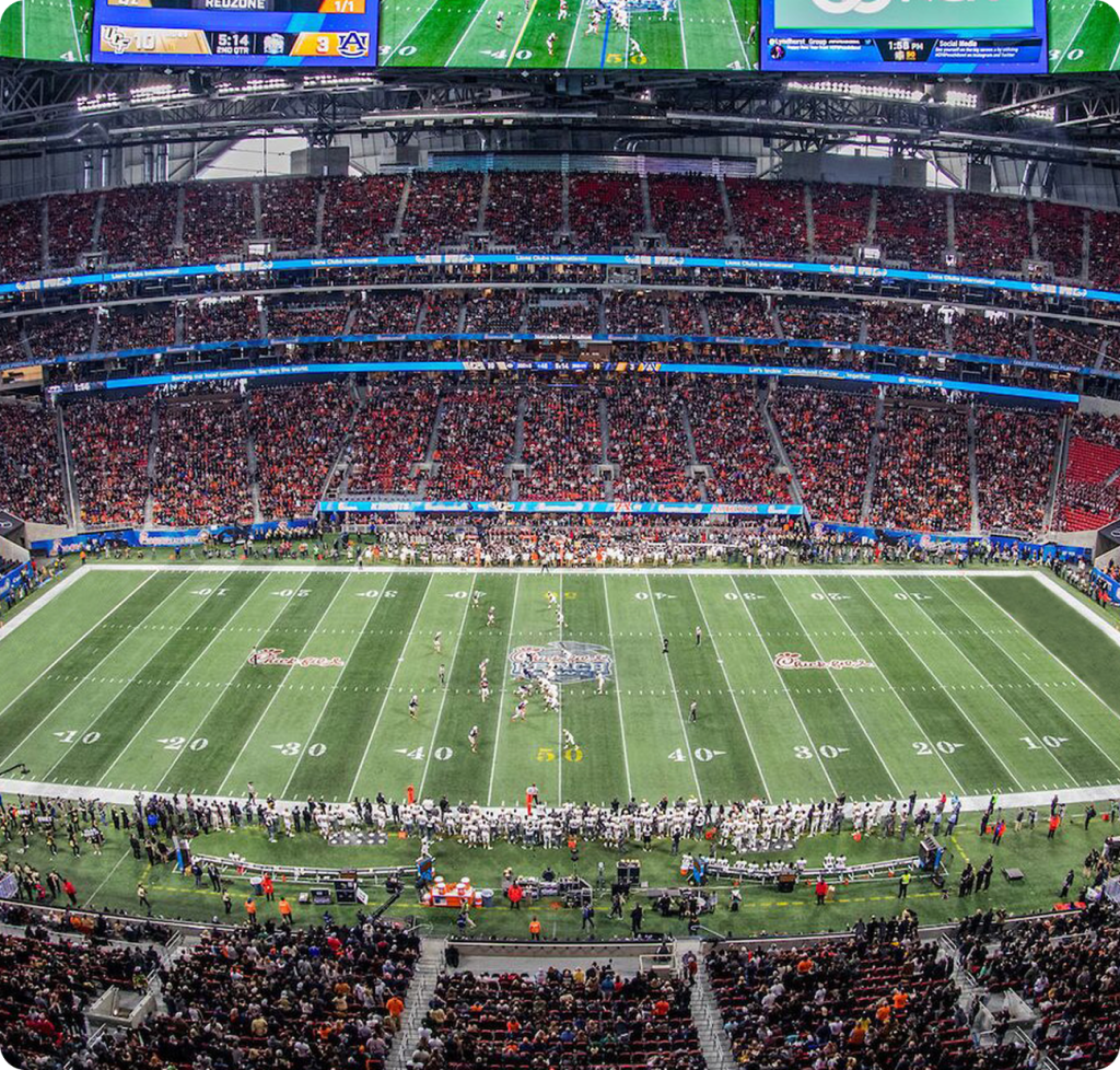 Touchdowns for children wide view of a football stadium filled with fans