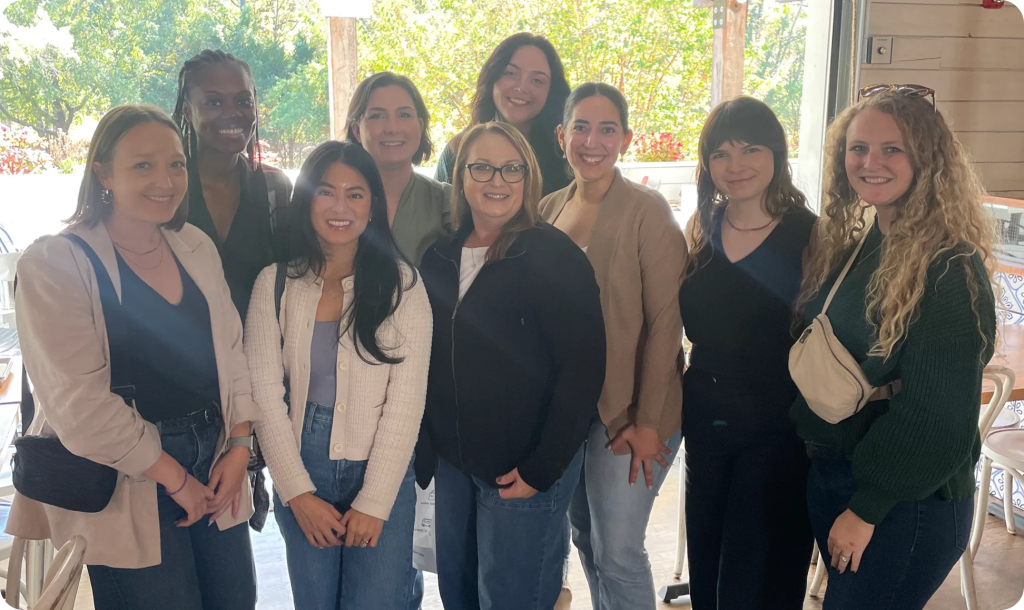 a group of women posing for a photo